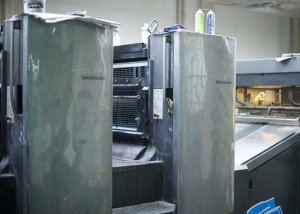 The heart of the operation, the workhorse of the game printing industry, a 5-color Heidleberg Speedmaster offset printer. One of these will turns out thousands of printed sheets per hour, once the proofing is done and the settings are tuned and locked in.